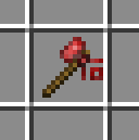 木の柄の先に紅天石のヘッドが付いた紅天石の斧